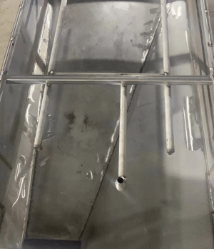 Custom stainless steel mixing tank with internal piping for industrial chemical processing