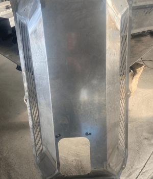 Custom metal equipment guard for industrial machinery protection and safety.